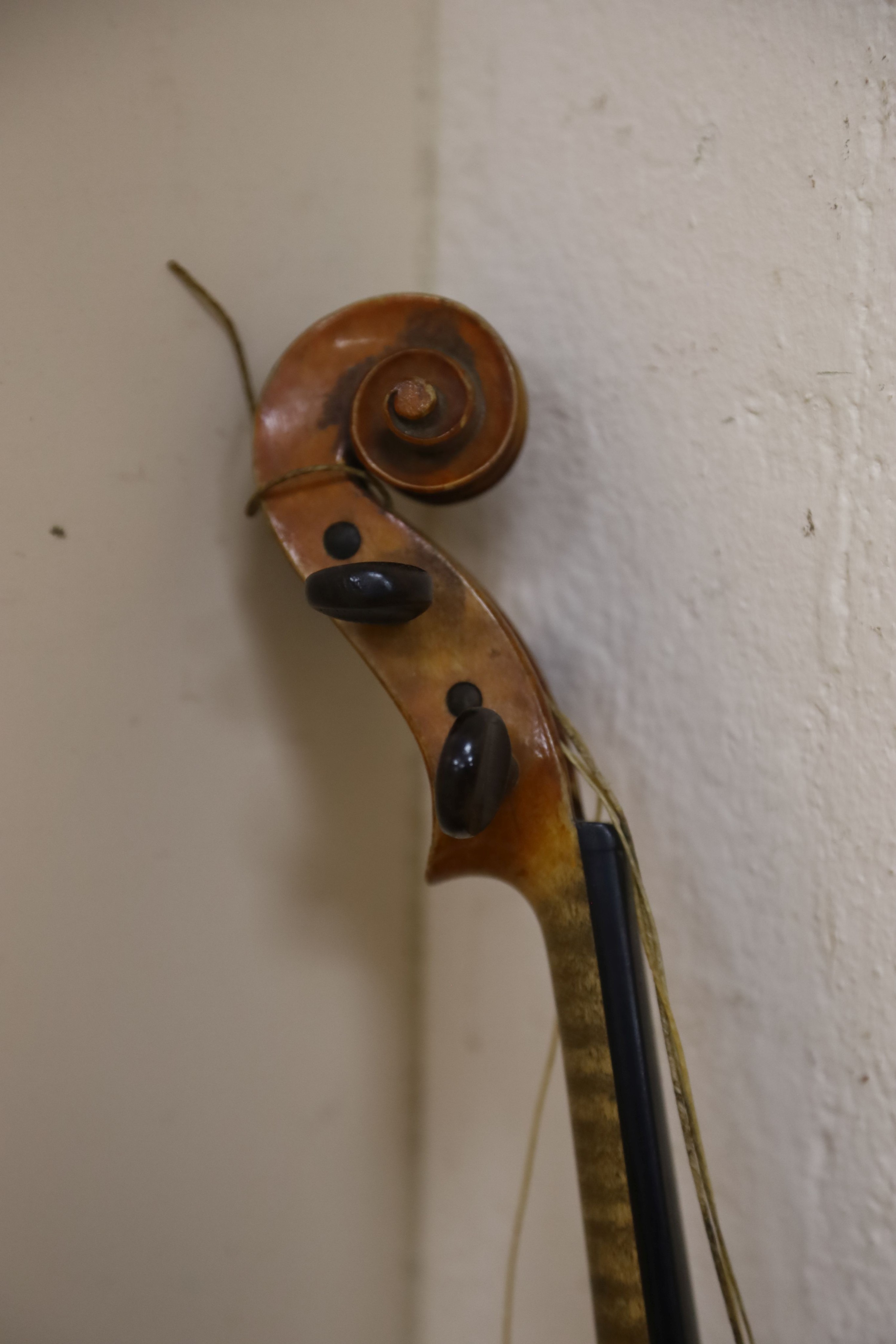 A Stradivarius copy violin and two bows and another bow, both cased, backs 33cm and 30cm